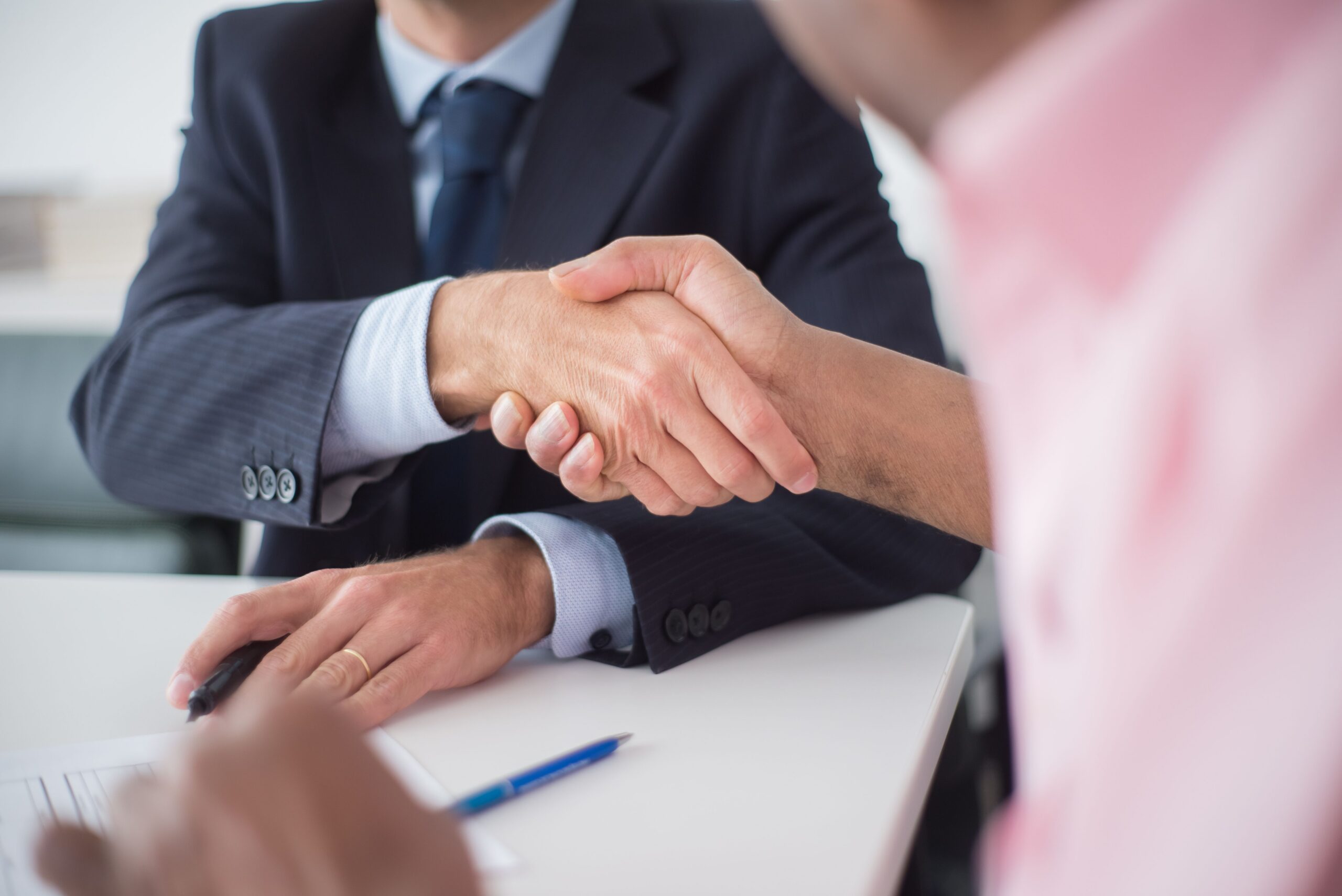 Close-up photo of two people shaking hands